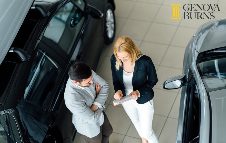 salesperson showing vehicle to potential customer 